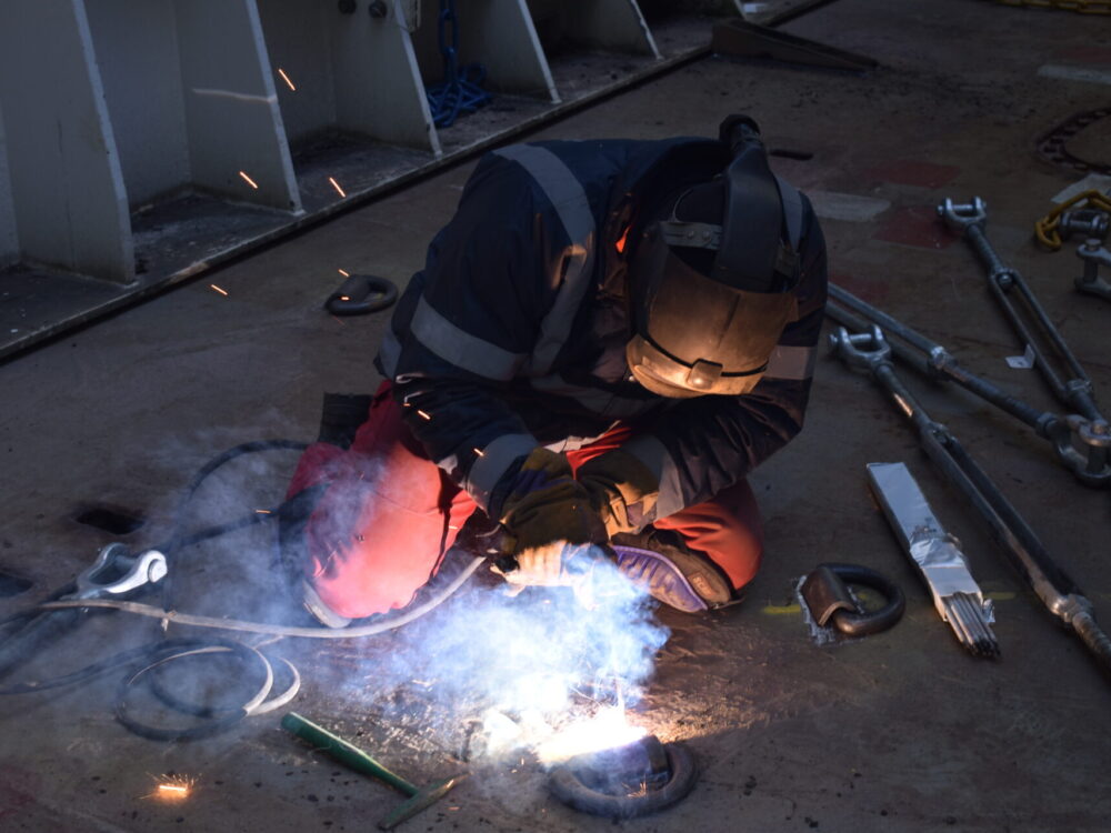 A skilled staff member welding at Shepherds Offshore